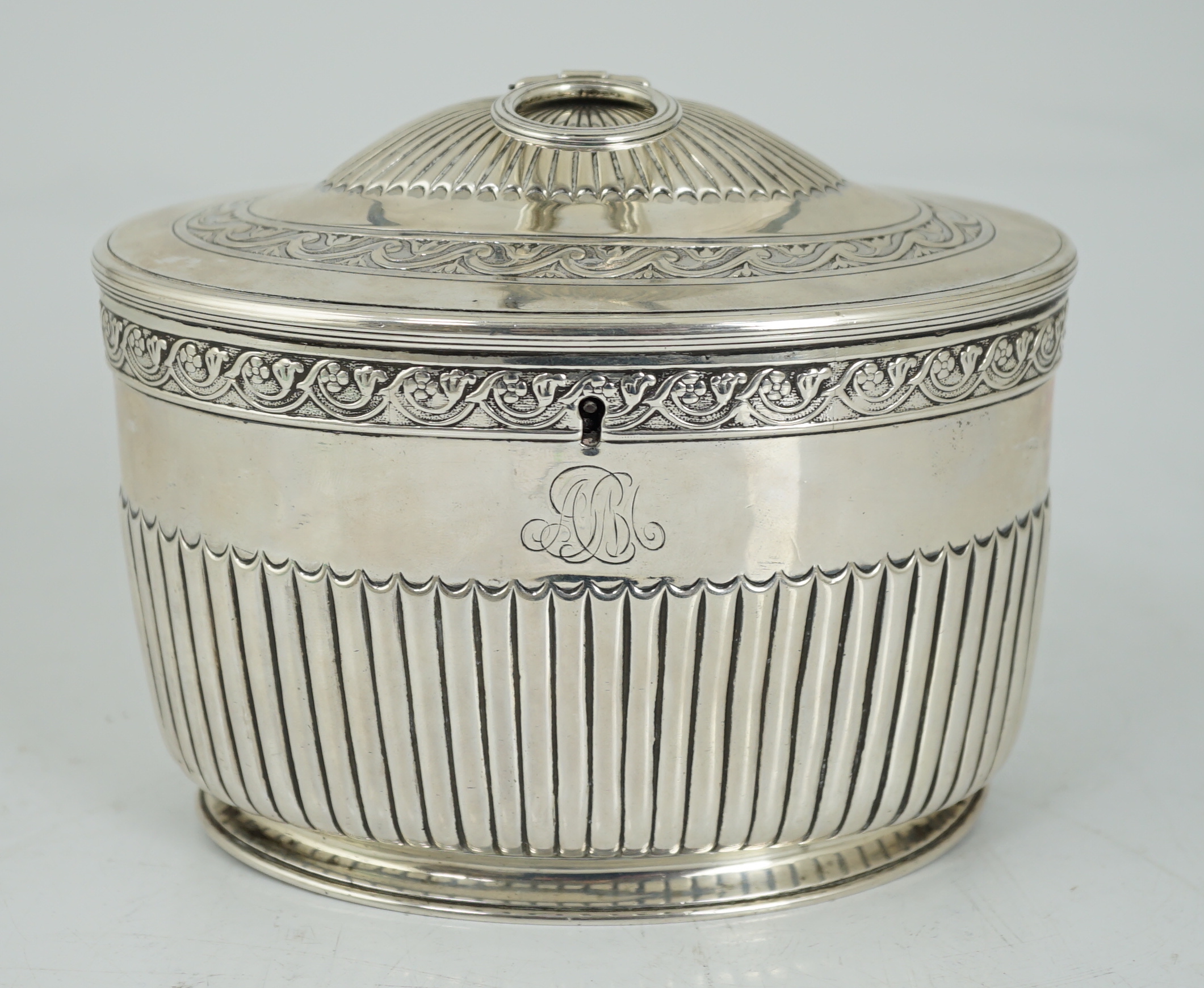 A George III demi fluted silver oval tea caddy by Andrew Fogelberg & Stephen Gilbert